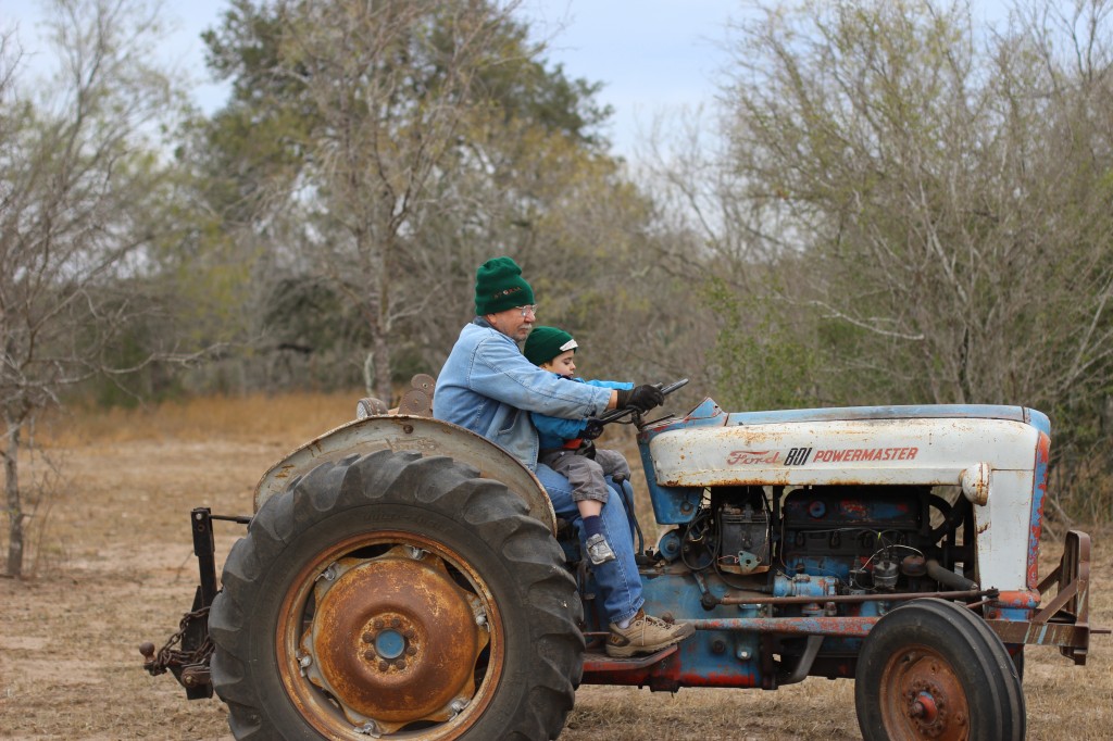 (James and Papa driving the tractor, the same one I used to drive with my grandpa.)