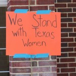 Walking with Cake: Texas Women sign